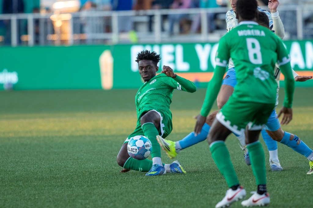 Beverly Makangila slides towards a loose ball against El Paso Locomotive FC