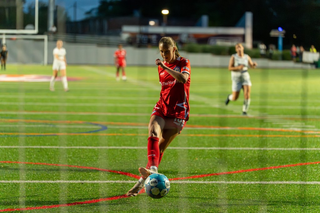 Alex Ackerman shoots a ball into the net