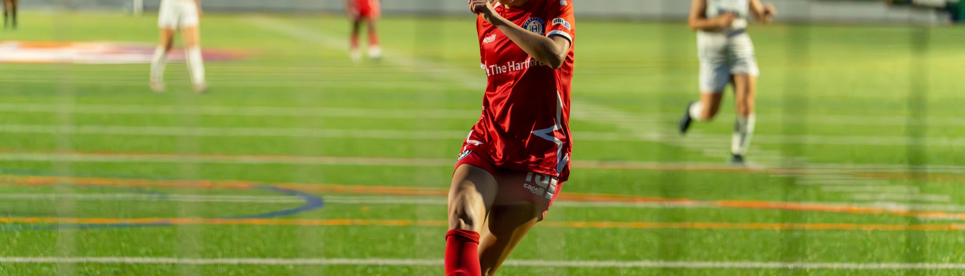 Alex Ackerman shoots a ball into the net